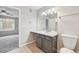 Bright bathroom features a vanity with storage space with access to the bedroom at 1259 W 112Th Ave # B, Denver, CO 80234