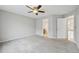 Bedroom featuring ceiling fan with ensuite bathroom at 1259 W 112Th Ave # B, Denver, CO 80234