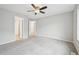 Bedroom features ceiling fan and access to multiple rooms at 1259 W 112Th Ave # B, Denver, CO 80234