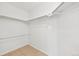 This large, all-white walk-in closet features ample storage with metal racks at 1259 W 112Th Ave # B, Denver, CO 80234