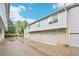 Well-kept townhomes in gray, each featuring private garages and tidy landscaping at 1259 W 112Th Ave # B, Denver, CO 80234
