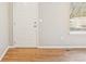 Bright foyer showcasing hardwood floors, fresh paint, and abundant natural light at 1259 W 112Th Ave # B, Denver, CO 80234
