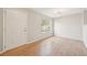 Bright foyer showcasing hardwood floors, fresh paint, and abundant natural light at 1259 W 112Th Ave # B, Denver, CO 80234
