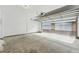 Spacious garage with an open overhead door, providing ample parking and storage space, with clean, painted walls at 1259 W 112Th Ave # B, Denver, CO 80234