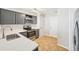 Well-lit kitchen features stainless steel appliances, modern cabinetry, and tile flooring for a functional cooking space at 1259 W 112Th Ave # B, Denver, CO 80234