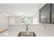 Bright kitchen featuring stainless steel sink with modern cabinets, backsplash and view of the living room at 1259 W 112Th Ave # B, Denver, CO 80234