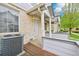 Townhouse porch featuring brick accents, covered entry, and landscaping for added curb appeal at 1259 W 112Th Ave # B, Denver, CO 80234
