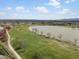 Beautiful aerial view of the golf course and community lake with distant mountain views at 7400 W Grant Ranch Blvd # 5, Littleton, CO 80123