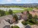 Beautiful aerial shot showing the home's location near a pond, golf course, and mountain views at 7400 W Grant Ranch Blvd # 5, Littleton, CO 80123