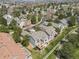 An aerial view of the property highlights the manicured lawn, deck, and neighborhood setting at 7400 W Grant Ranch Blvd # 5, Littleton, CO 80123