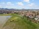 Scenic aerial view of the community homes surrounding the golf course and lake at 7400 W Grant Ranch Blvd # 5, Littleton, CO 80123