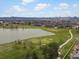 Overhead shot of the golf course, lake and community homes with scenic mountain views at 7400 W Grant Ranch Blvd # 5, Littleton, CO 80123