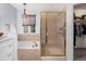 Bright bathroom featuring a soaking tub, a glass-enclosed shower, and stylish fixtures at 7400 W Grant Ranch Blvd # 5, Littleton, CO 80123