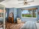 Serene bedroom featuring a window with a view, a floral chair, and hardwood floors for a relaxing atmosphere at 7400 W Grant Ranch Blvd # 5, Littleton, CO 80123
