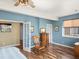 Charming bedroom with a rocking chair, classic dresser, and bright windows creating a serene atmosphere at 7400 W Grant Ranch Blvd # 5, Littleton, CO 80123
