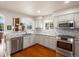 Well-lit kitchen with granite countertops, stainless steel appliances, and neutral cabinetry providing a modern and functional space at 7400 W Grant Ranch Blvd # 5, Littleton, CO 80123