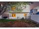 Large backyard with mature tree providing shade, with access to patio at 4705 Andes St, Denver, CO 80249