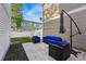 Cozy backyard patio with wicker seating and a modern cantilever umbrella at 4705 Andes St, Denver, CO 80249