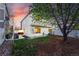 Well-maintained backyard featuring a lush lawn, privacy fence, and patio furniture at 4705 Andes St, Denver, CO 80249