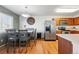 Charming dining area featuring a stylish table set, stainless steel appliances, and a modern aesthetic at 4705 Andes St, Denver, CO 80249