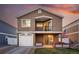 Attractive home showcasing a covered porch, attached garage, and manicured front lawn at 4705 Andes St, Denver, CO 80249