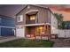 Charming two-story home featuring a balcony, well-kept lawn, and inviting curb appeal at 4705 Andes St, Denver, CO 80249