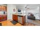 Modern kitchen featuring a stainless steel dishwasher, updated cabinets, and a spacious island, perfect for cooking at 4705 Andes St, Denver, CO 80249