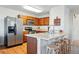 Well-equipped kitchen with stainless steel appliances, a breakfast bar, and plenty of cabinet space, great for cooking at 4705 Andes St, Denver, CO 80249