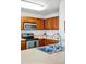 Charming kitchen featuring stainless steel appliances, bright countertops, and lots of cabinet space at 4705 Andes St, Denver, CO 80249