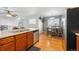 Bright kitchen features stainless steel appliances and a charming dining area at 4705 Andes St, Denver, CO 80249