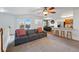 Open concept living area with plush sofa, bar seating, and natural light, perfect for entertaining at 4705 Andes St, Denver, CO 80249