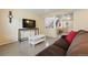 Spacious living room with comfortable seating, entertainment area, and a view of the entryway at 4705 Andes St, Denver, CO 80249