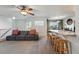 Inviting living area with cozy sofa, bar seating, and open layout, ideal for comfortable living and entertaining at 4705 Andes St, Denver, CO 80249