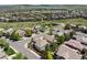 A high angle of a neighborhood featuring well-maintained homes, a pond, and a walking path near open green spaces at 10832 Montvale Cir, Highlands Ranch, CO 80130