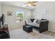 Comfortable bedroom with a daybed, carpet, and a bright window overlooking the neighborhood at 10832 Montvale Cir, Highlands Ranch, CO 80130
