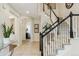 Spacious foyer with tile flooring, staircase, and views into adjacent rooms at 10832 Montvale Cir, Highlands Ranch, CO 80130