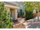 Inviting covered front entrance with stone walkway and landscaping at 10832 Montvale Cir, Highlands Ranch, CO 80130