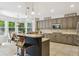 Well-designed kitchen with a large island, granite countertops, and stainless steel appliances at 10832 Montvale Cir, Highlands Ranch, CO 80130