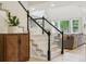 Elegant staircase featuring white railings and a cozy living room visible in the background at 10832 Montvale Cir, Highlands Ranch, CO 80130