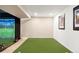 Finished basement with golf simulator at 1382 Raindrop Way, Castle Rock, CO 80109