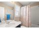 Bright bathroom featuring a vanity with solid surface counters and shower with tub at 1382 Raindrop Way, Castle Rock, CO 80109