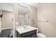 Bathroom featuring a vanity with solid surface counters and walk-in shower at 1382 Raindrop Way, Castle Rock, CO 80109