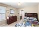 Bedroom with large window and a decorative comforter at 1382 Raindrop Way, Castle Rock, CO 80109