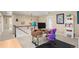 Spacious loft area with desk, chandelier, and view of the staircase at 1382 Raindrop Way, Castle Rock, CO 80109