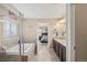 Beautiful main bathroom with soaking tub, glass shower, and dual vanity sinks at 1382 Raindrop Way, Castle Rock, CO 80109