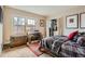 Bedroom with built-in closet, desk, hardwood floors, and natural light at 960 N Sherman St # 3F, Denver, CO 80203