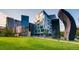 A green lawn is the foreground to community apartments and condominium buildings made of mixed mediums of steel and concrete at 960 N Sherman St # 3F, Denver, CO 80203