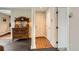 Hallway with a vintage cabinet and tile transitioning into hardwood floors at 960 N Sherman St # 3F, Denver, CO 80203