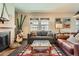 Comfortable living room with a decorative fireplace, stylish furnishings, and natural light at 960 N Sherman St # 3F, Denver, CO 80203
