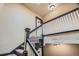 Carpeted staircase with white railing and decorative wall texture, leading to upper floors at 960 N Sherman St # 3F, Denver, CO 80203